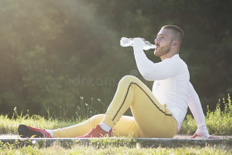 Drinking Water after Jogging Stock Photo Image of recreation