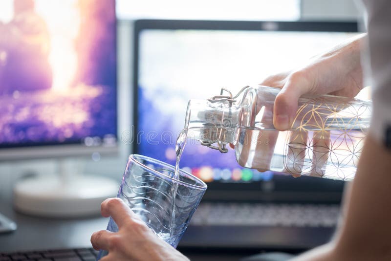 Drinking Water in the Office Close Up of Glass Bottle, Workplace Stock