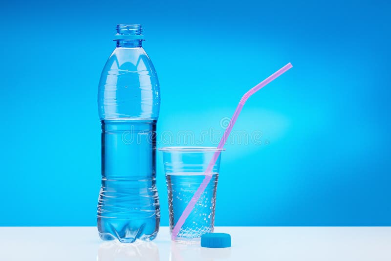 https://thumbs.dreamstime.com/b/drinking-water-plastic-bottle-water-gas-plastic-glass-pink-straw-bottle-fresh-water-white-table-blue-140787266.jpg