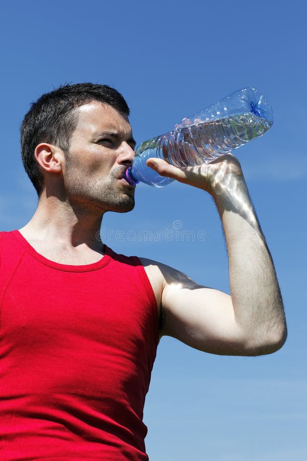 Drinking water after sport stock photo. Image of muscle 19365714