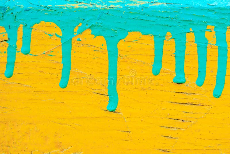 Dripping green paint on the yellow, the old cracked paint background texture