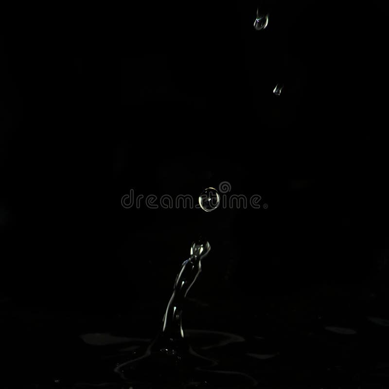 Dripping Liquid, Formed a High Pillar and Three Balls of Water. Stock