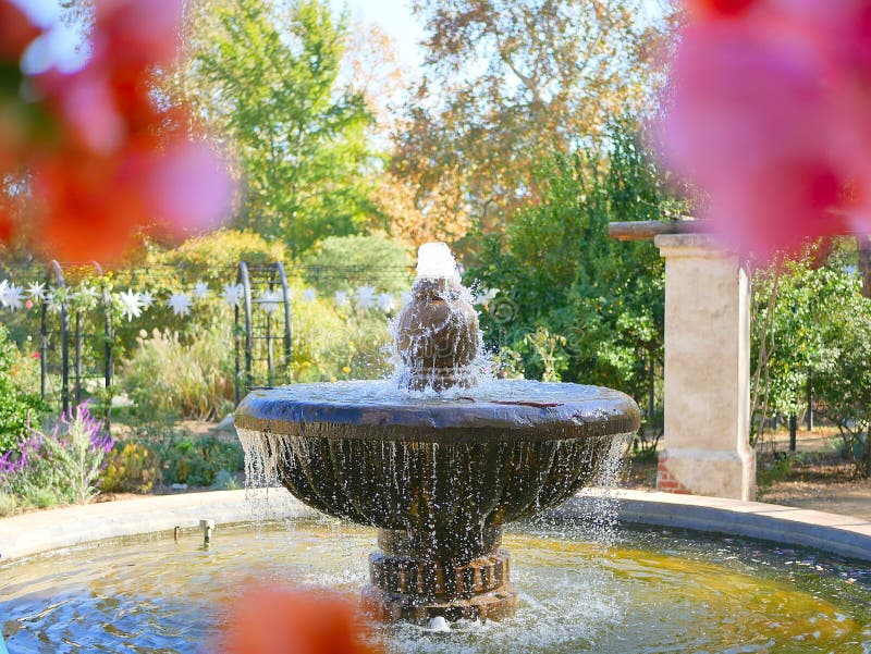 Fountain with Pink Flowers in Foreground royalty free stock images Fountain with Pink Flowers in Foreground royalty free stock images
