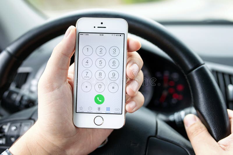 Driver in the car dials the number iphone 5s Gold