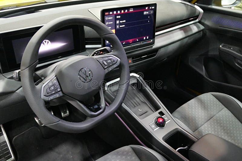 Driver cockpit and front seat interior view of modern german subcompact crossover SUV car Volkswagen T-Roc, second generation launched in 2025, displayed on car expo in Nitra, Slovakia, october 2025.
