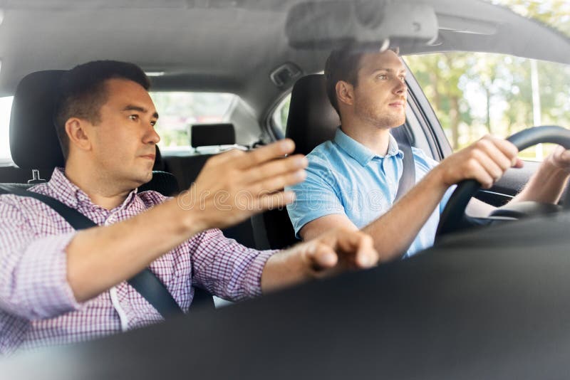 Car Driving School Instructor Teaching Male Driver Stock Photo - Image