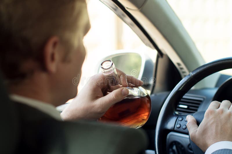 Driver Drinks Alcohol while Driving Stock Image Image of intoxicated, alcoholic 67310297