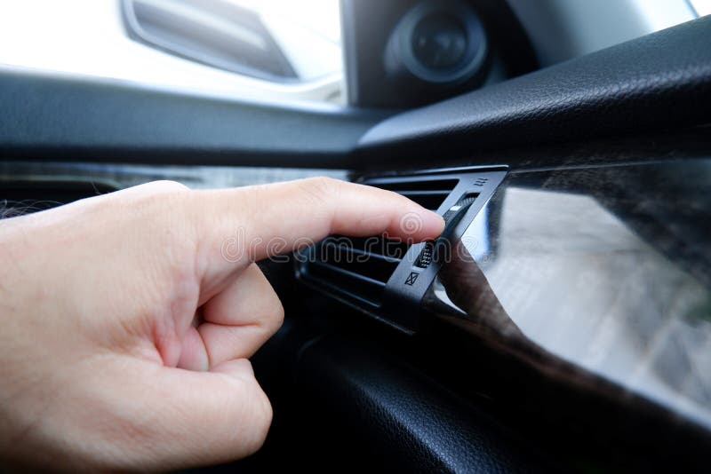 The Driver Hand Adjust the Wind Speed of the Car Air Vent Stock Image