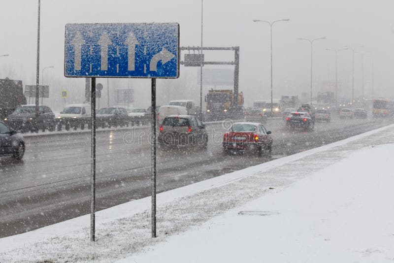 Driving a car in bad weather conditions, heavy snow fall royalty free stock images Driving a car in bad weather conditions, heavy snow fall royalty free stock images