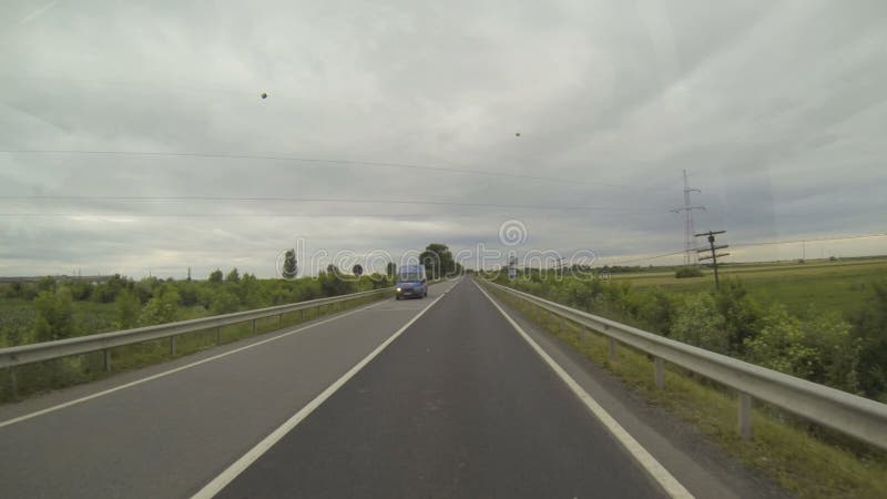 Driving a Car on a Country Road - Point of view front. Gloomy day stock footage