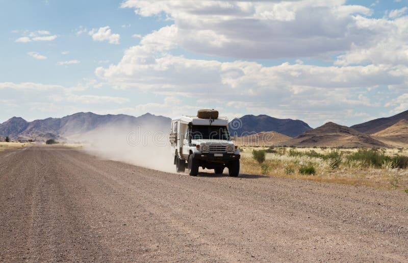 Driving in a dirt road stock photo. Image of wildlife 48570192