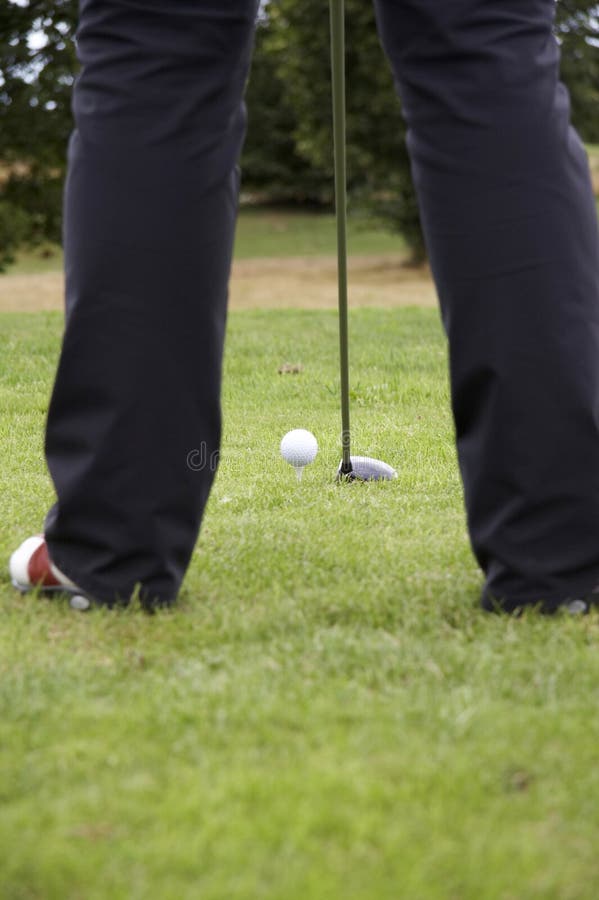 Driving the golf ball 01 stock photo. Image of women, legs 1066052