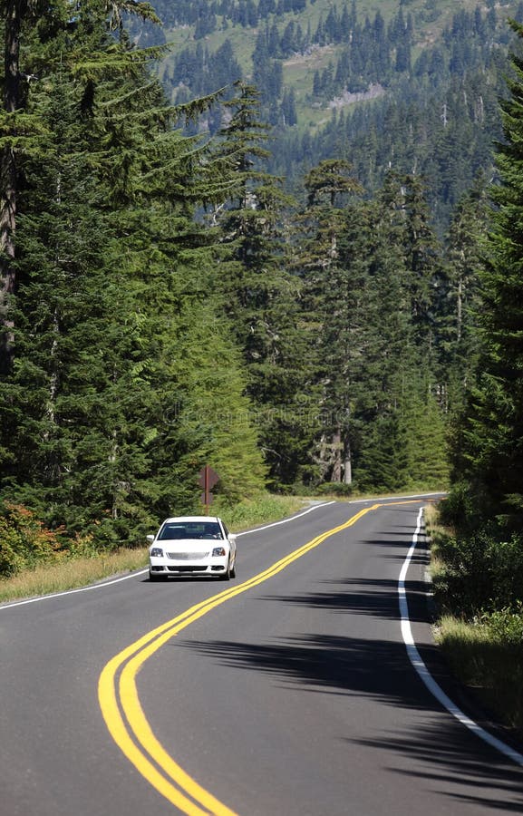 A Car on the Highway in Rainier National Park. Stock Image Image of