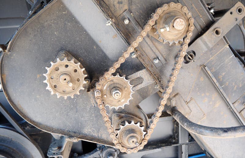 Driving Roller Chain on the Drive Sprocket in Operation Stock Photo