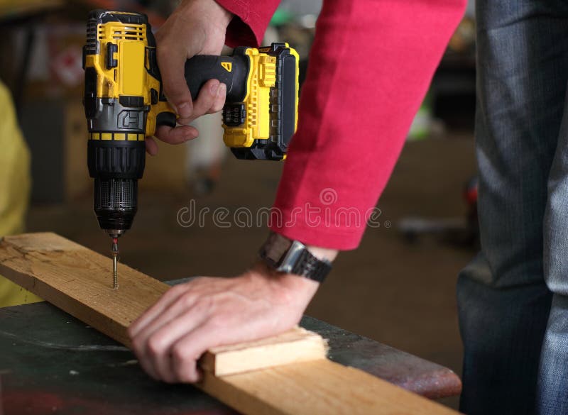Driving the Screws with a Drill Stock Image Image of battery
