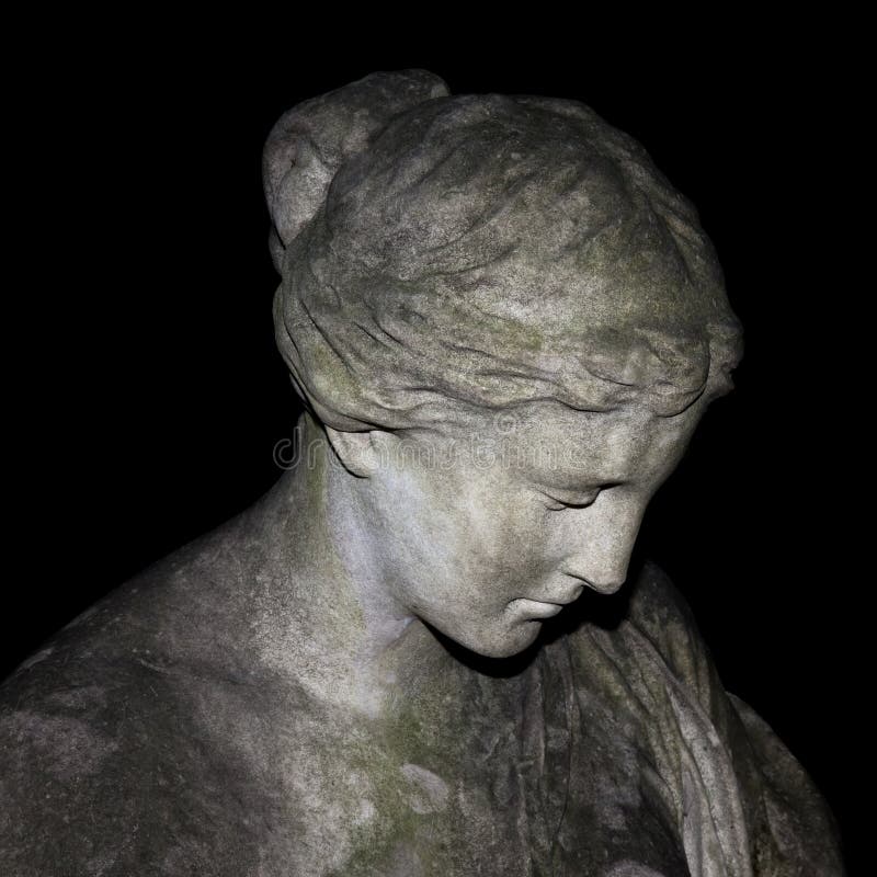 An image of a sad woman statue. An image of a sad woman statue