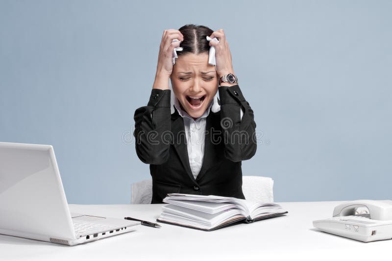 Sad business woman in office working with white table, laptop and diary personal organizer. Problem!. Sad business woman in office working with white table, laptop and diary personal organizer. Problem!