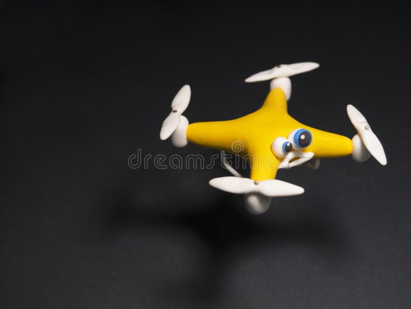 The drone Close up of quadrocopter with the parcel. tired stock photo The drone Close up of quadrocopter with the parcel. tired stock photo
