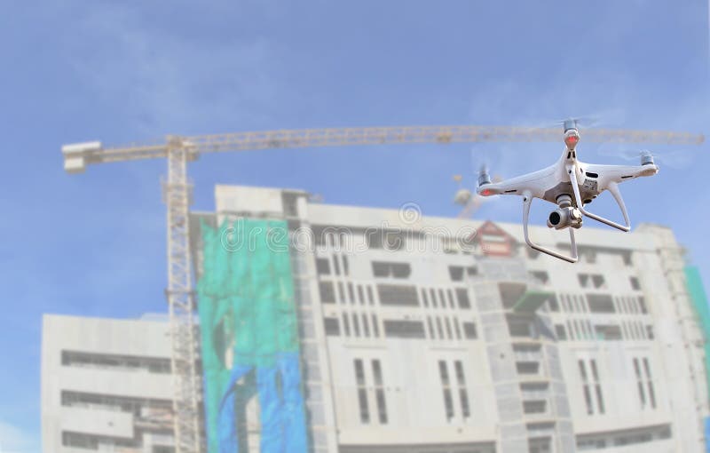 drone copter flying with digital camera.Drone with high resolution digital camera over construction site royalty free stock photography drone copter flying with digital camera.Drone with high resolution digital camera over construction site royalty free stock photography