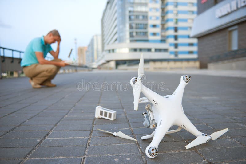 drone-crash-fallen-damaged-quadrocopter-city-flying-lying-ground-97803193.jpg