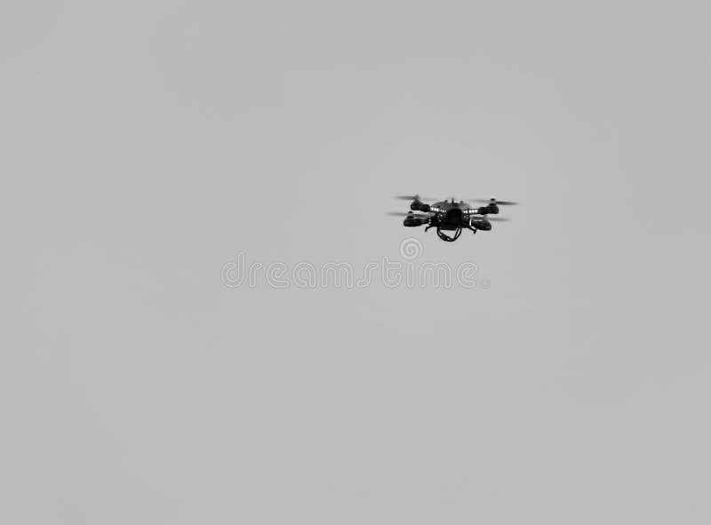 drone flying against a blue sky