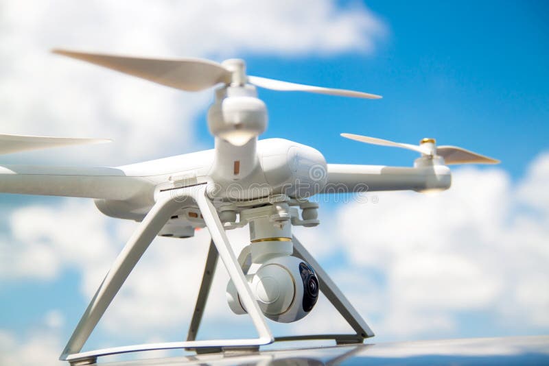 Drone landing on a landing pad under the blue sky. royalty free stock photo Drone landing on a landing pad under the blue sky. royalty free stock photo