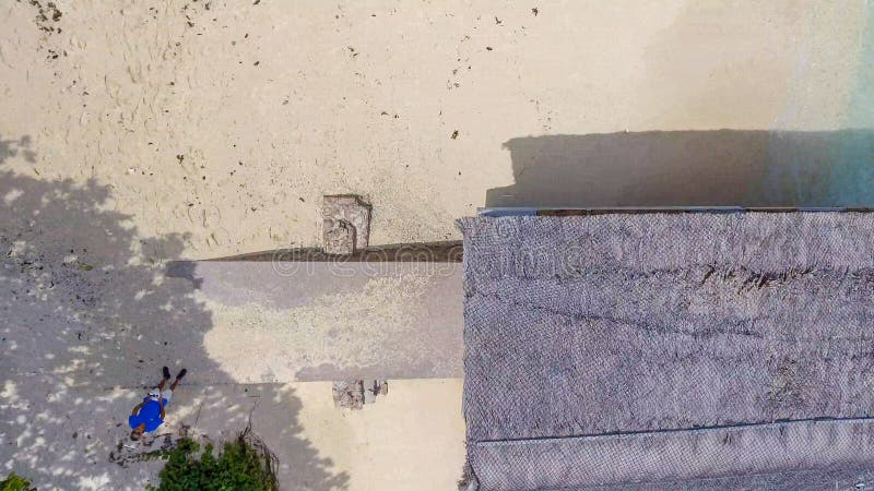 Drone pilot on the beach, aerial view from drone perspective stock photography