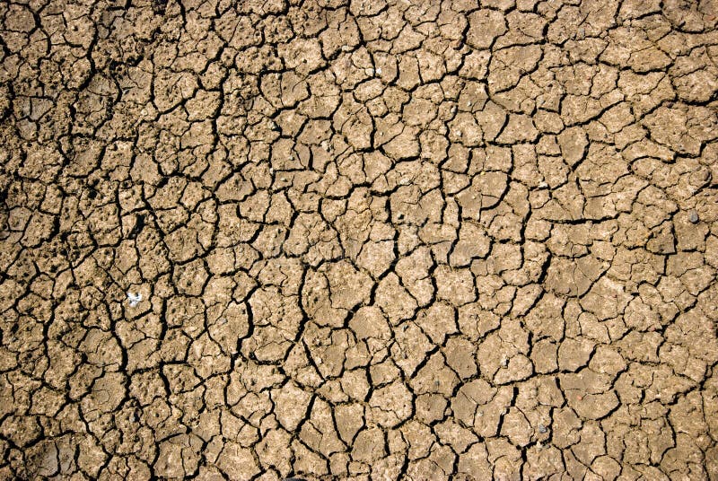 Droog gebarsten grond tijdens droogte royalty-vrije stock afbeelding Droog gebarsten grond tijdens droogte royalty-vrije stock afbeelding