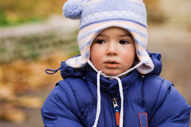 Drooling baby boy with a runny nose from a cold. Drooling baby boy with a runny nose from a cold.