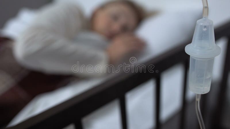 Drop counter closeup, female patient lying in hospital bed, therapy and medicine