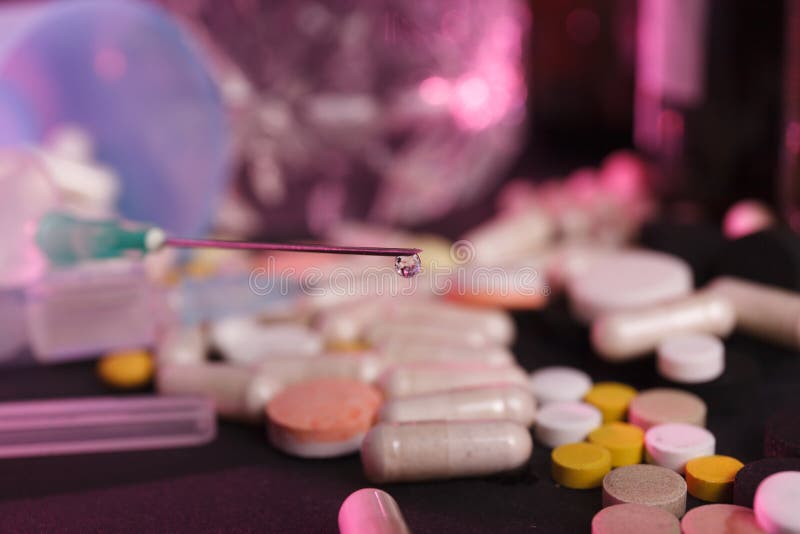 Drop on a syringe needle stock photo. Image of closeup 110832408