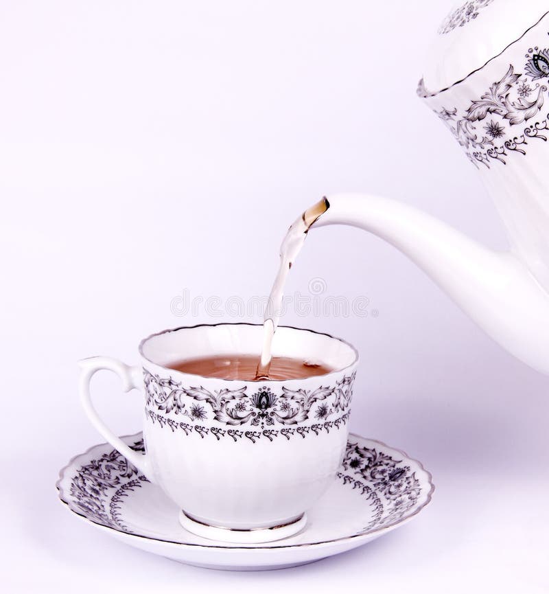 Drop Tea from Teapot To Teacup Stock Photo Image of white