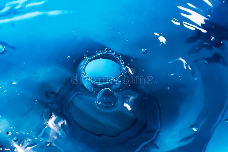Drop of Water. Blue Water Drop. Falling Water. Water Splash Closeup