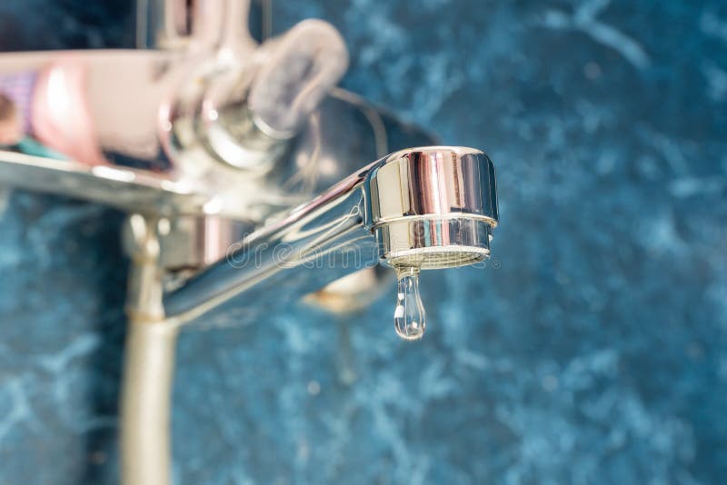 A Drop of Water Drips from a Leaky Faucet Stock Photo Image of