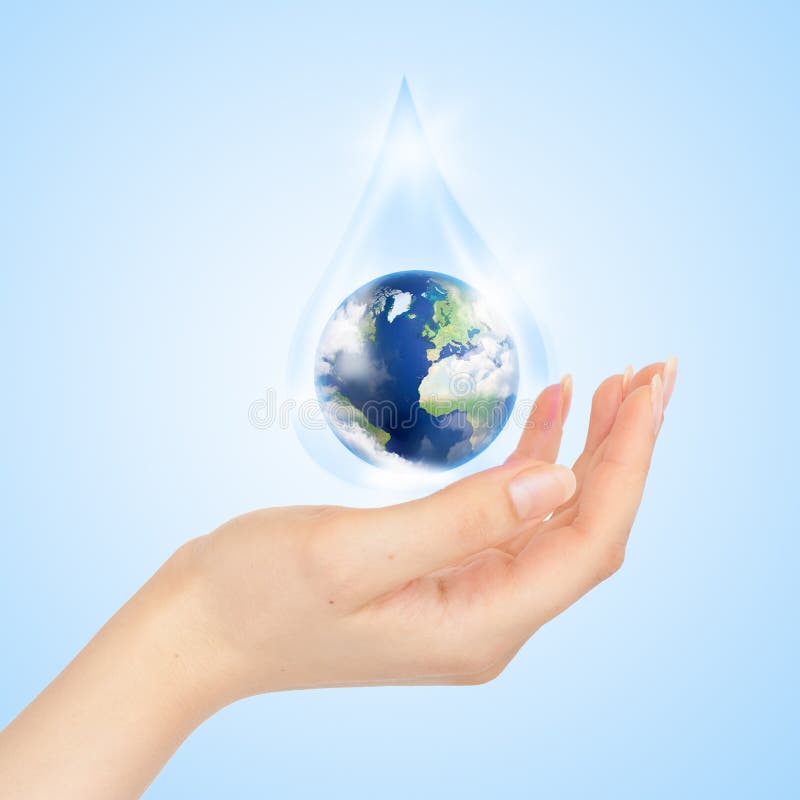 Drop of water with Earth inside and hand