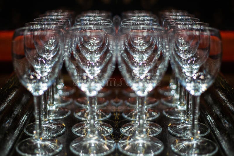 A drop of water on a glass. freeze glass. Champagne glasses on a tray