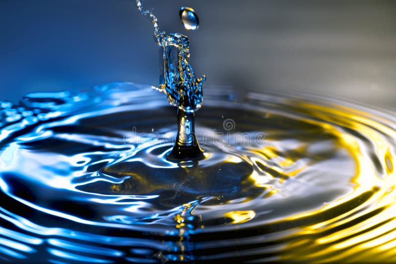 Droplet high speed fluid photography. Collision captured in mid air. Droplet high speed fluid photography. Collision captured in mid air.