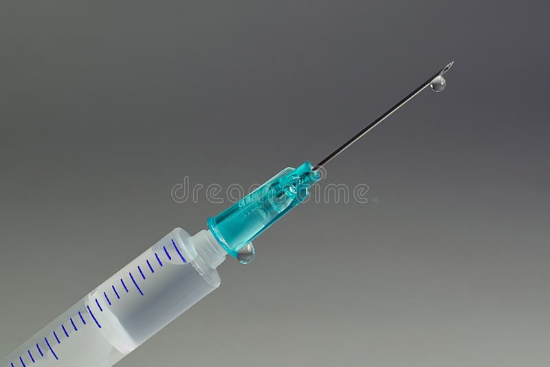 A macro shot of a hypodermic needle with a droplet of fluid. Illustrates many concepts, from health care to drug abuse. A macro shot of a hypodermic needle with a droplet of fluid. Illustrates many concepts, from health care to drug abuse.