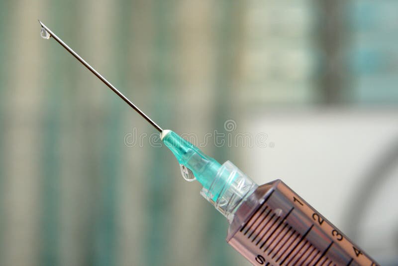 A macro shot of a hypodermic needle with a droplet of fluid. Illustrates many concepts, from health care to drug abuse. A macro shot of a hypodermic needle with a droplet of fluid. Illustrates many concepts, from health care to drug abuse.