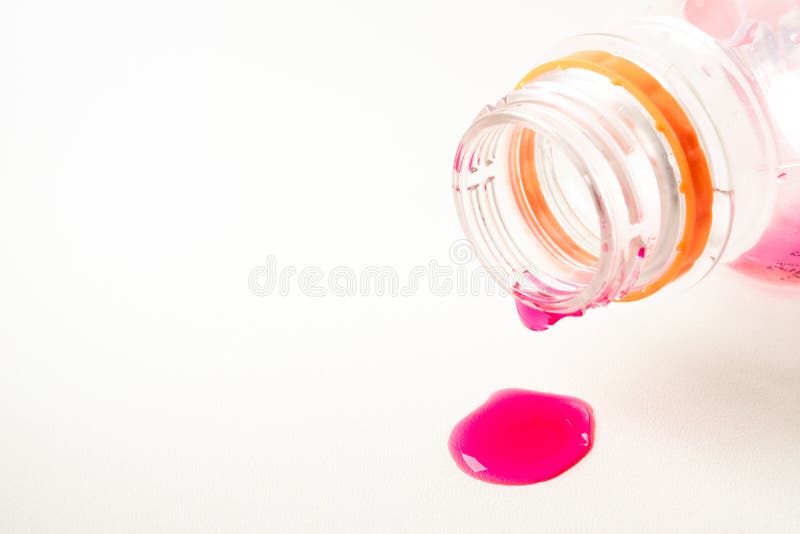 Droplet pink color water from empty soft drink bottle in white background, beverage, drinkinh, drinking, sweet, sugary. Droplet pink color water from empty soft drink bottle in white background, beverage, drinkinh, drinking, sweet, sugary