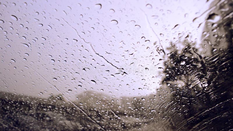 Drops of rain on blue glass background / drops on glass stock footage Drops of rain on blue glass background / drops on glass stock footage