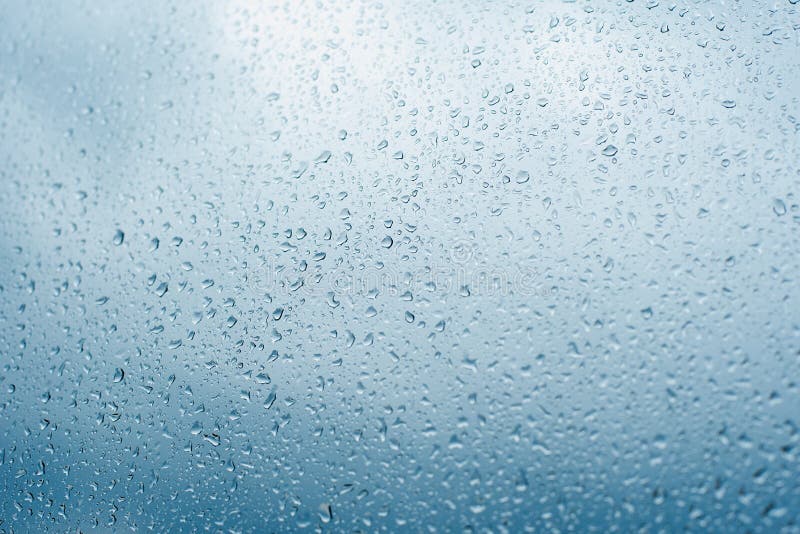 Drops of rain on the window glass Shallow DOF. Window after rain. Blue Water background with water drops stock photography Drops of rain on the window glass Shallow DOF. Window after rain. Blue Water background with water drops stock photography