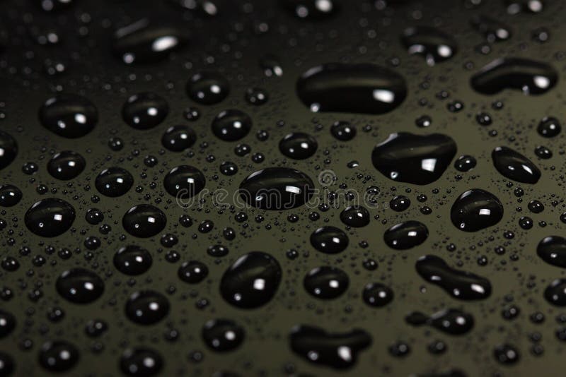 Drops of water on a dark background.