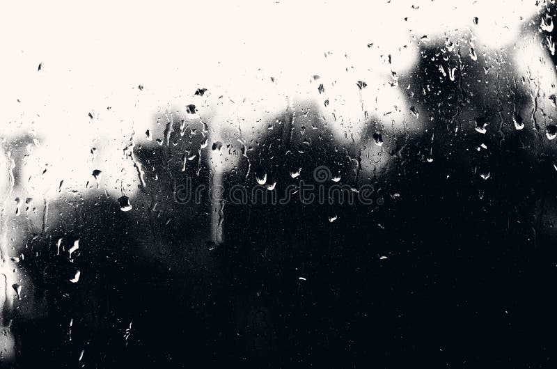 Drops of water on glass with a black mourning background