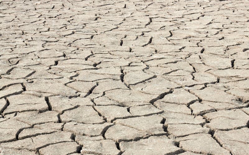 Drought barren cracked soil textured background, global warming stock photos