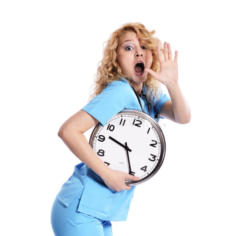 Stress - nurse woman running late with clock under her arm. Healthcare concept photo with young worker in a hurry running against time. Caucasian model isolated on white background. Stress - nurse woman running late with clock under her arm. Healthcare concept photo with young worker in a hurry running against time. Caucasian model isolated on white background.