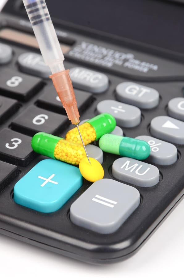 Medicine and calculator stock image. Image of keypad 29077845