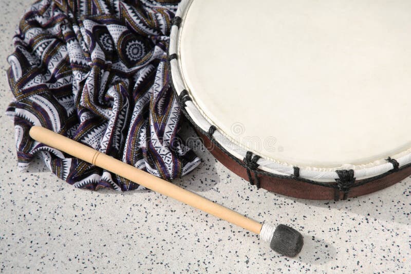 Drum and Drumstick on Grey Table, Above View. Percussion Musical