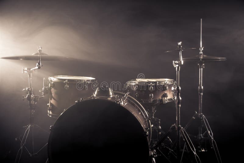 Drum Set in a Dark Room Against the Backdrop of the Spotlight