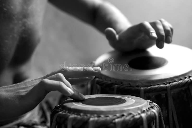 Man playing the djembe (nigerian drum) in studio. Man playing the djembe (nigerian drum) in studio